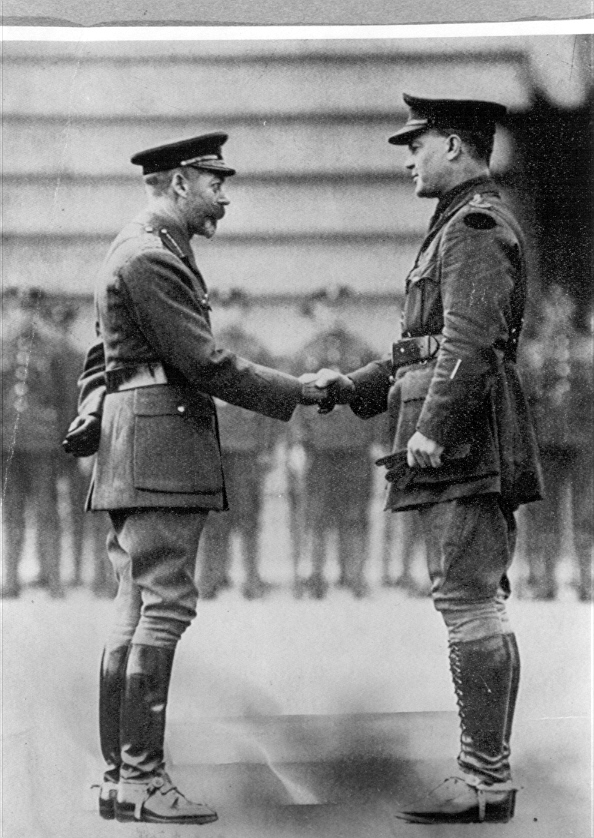 King George V presents the Victoria Cross to Captain RC Grieve at Buckingham Palace. 1917